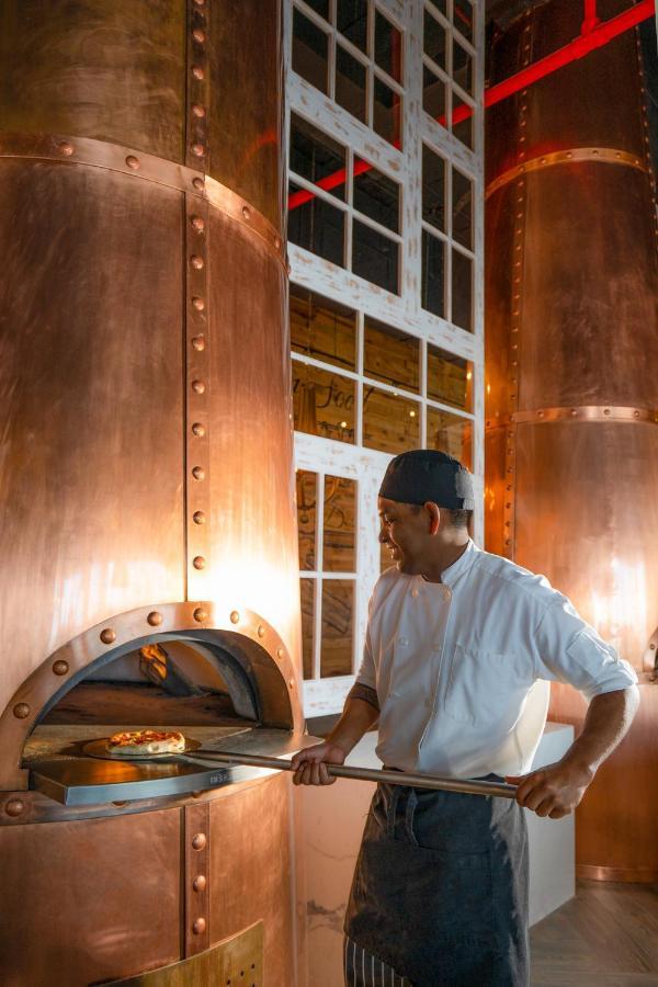 Nickelodeon Hotels & Resorts Riviera Maya Пуэрто-Морелос Экстерьер фото A distillery worker checking the temperature of the mash